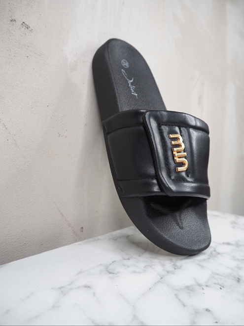 italienische mode kleiber werksverkauf Schwarze MIN-Slides aus gestepptem Leder mit goldenem Logo