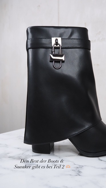italienische mode kleiber werksverkauf Schwarze Stiefelette mit Vorhängeschloss-Detail; stylisches Schuhwerk für Modetrends.