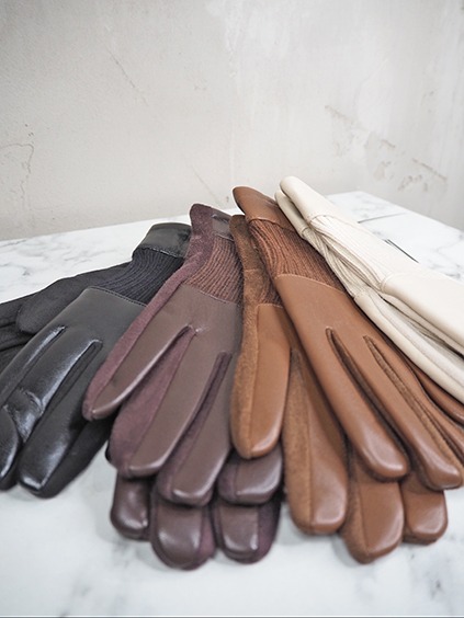italienische mode kleiber werksverkauf Mehrere Lederhandschuhe in verschiedenen Brauntönen und Schwarz